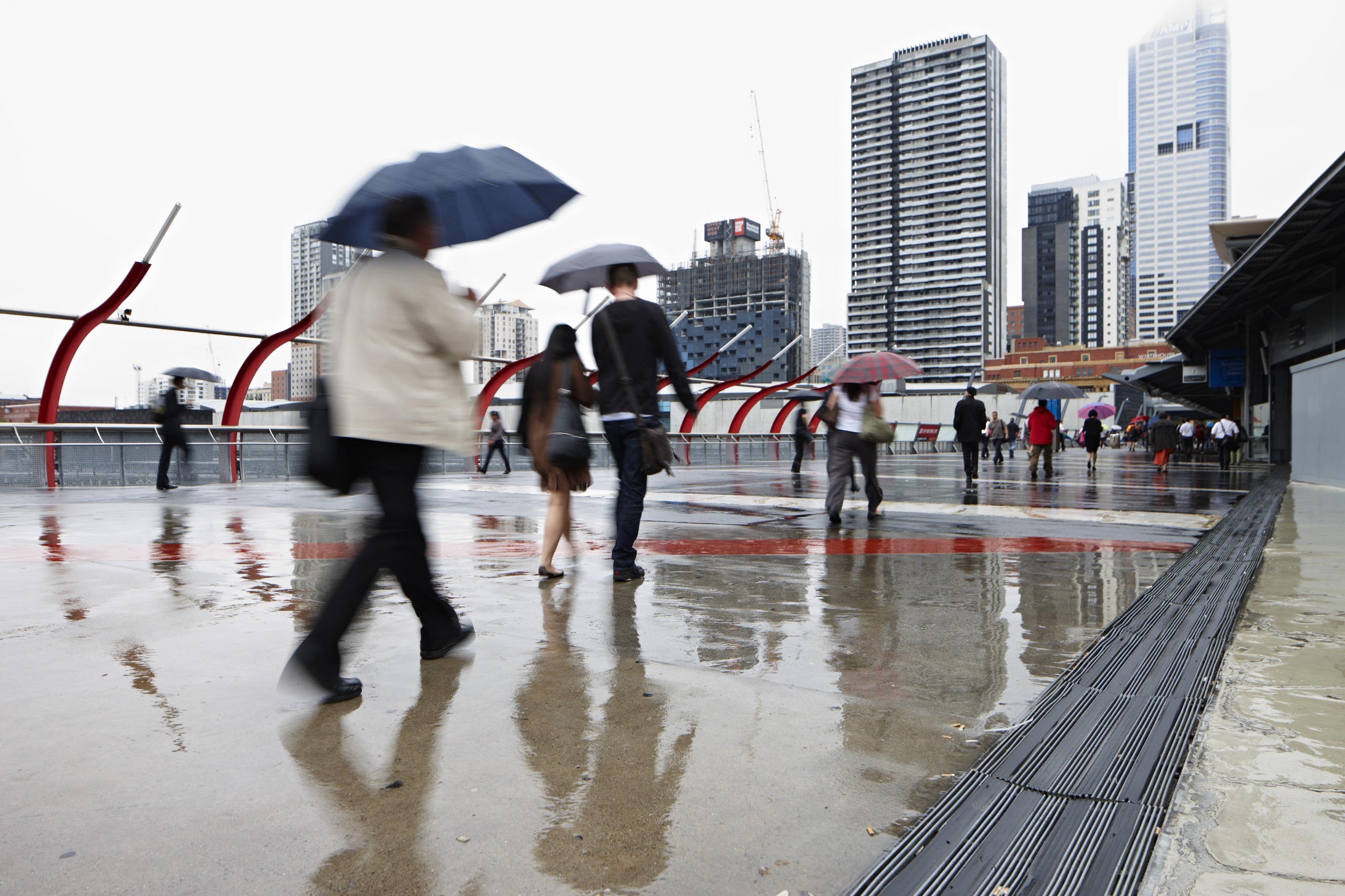 People walking with umbrellas on the rainy day