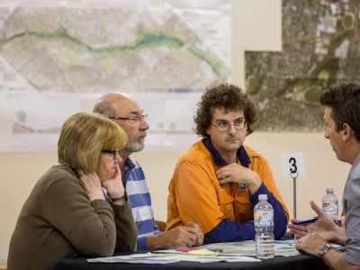 Community Advisory Group members sitting at table and discussing concept design
