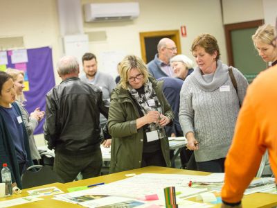 Tarralla Creek Community Advisory Group ladies standing around table 